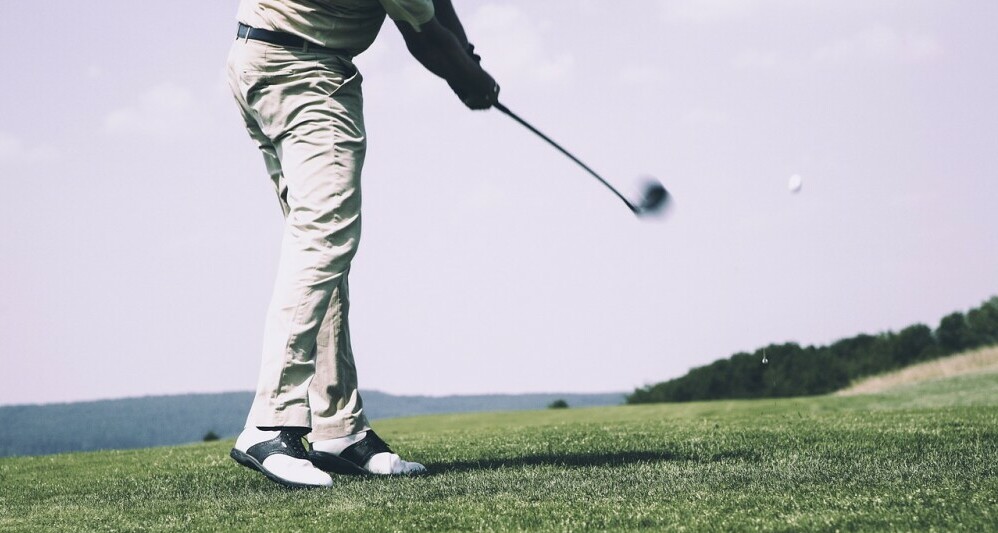 golfer driving ball